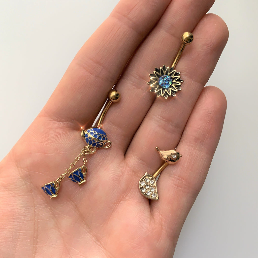 Gold Tone Aqua Center Sunburst Flower Belly Ring