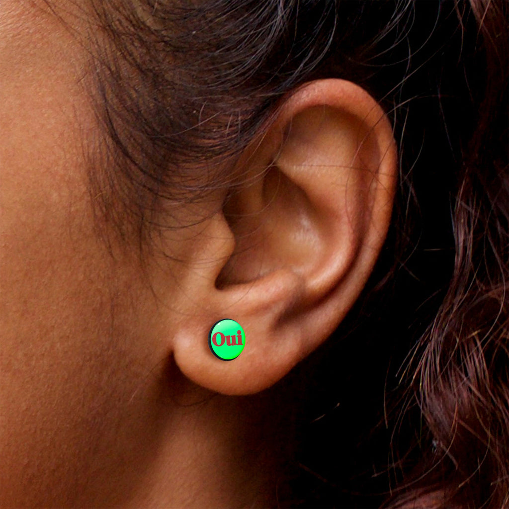 Black Anodized OUI Glow in the Dark Stud Earrings by Onyx O